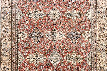 A semi-antique/old Nain carpet, part silk, c. 343 x 230 cm.