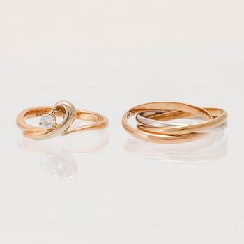 Rings, 2 pcs, 14K gold and round brilliant-cut diamond.