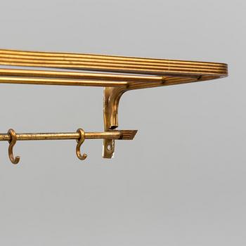 A 20th century brass cloth rack/hanger.