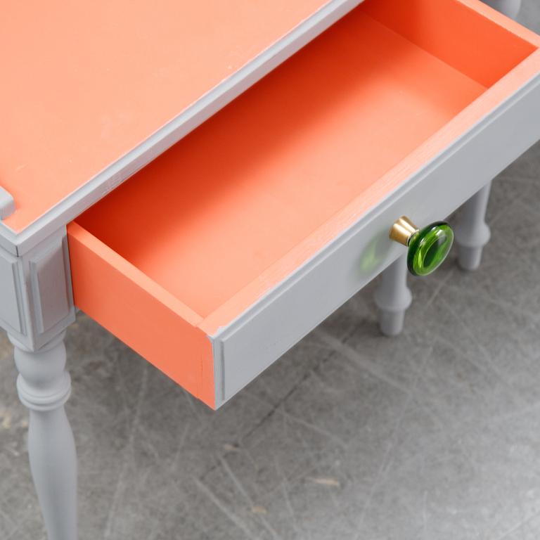 A pair of 20th Century bedside tables.