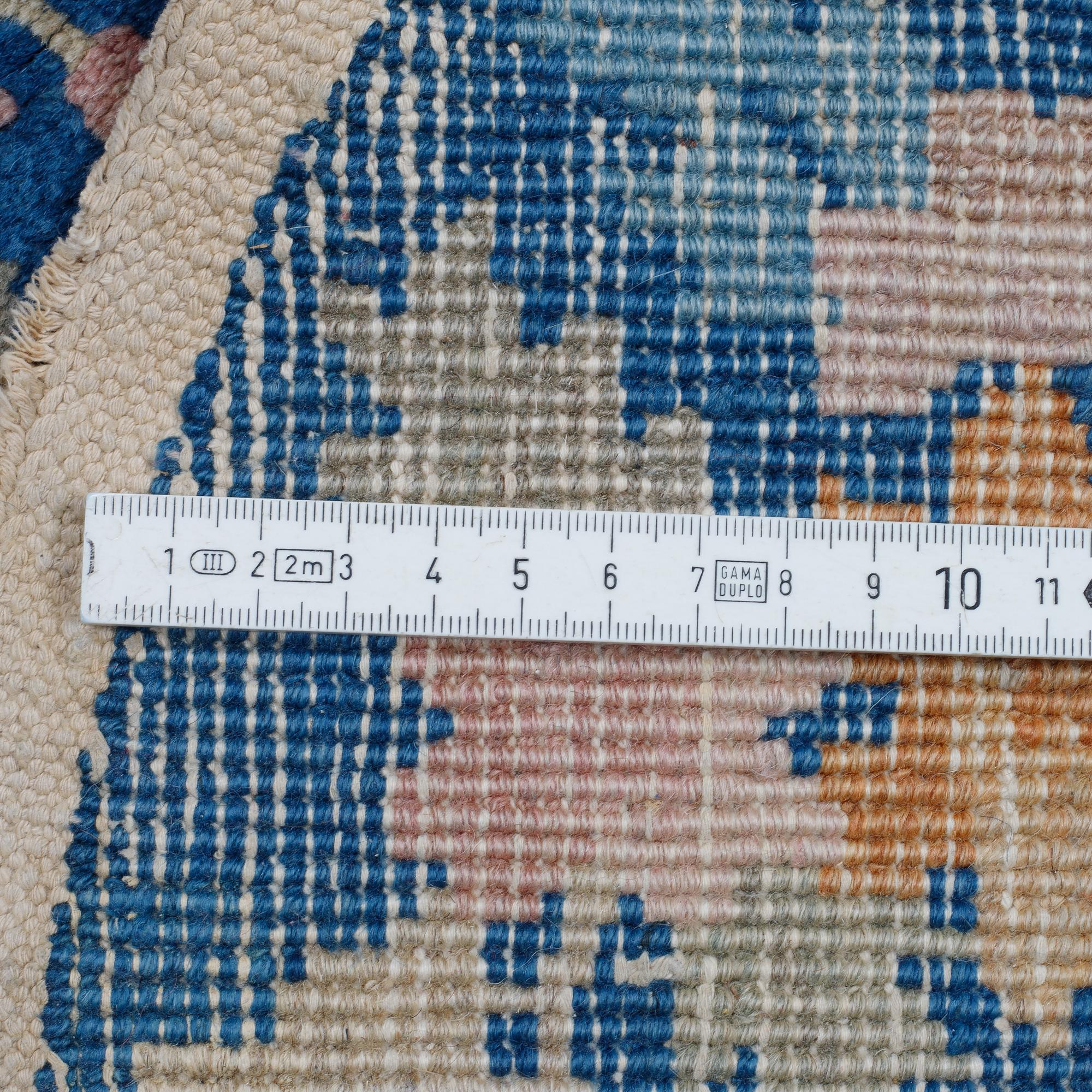 A pair of semi-antique/Old, Chinese rugs, ca 138 x 77 cm.
