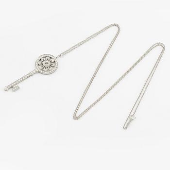 A platinum "Tiffany Keys" pendant set with round brilliant-cut diamonds.