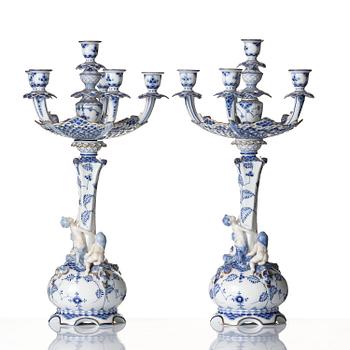 A pair of Royal Copenhagen 'Musselmalet' / 'blue fluted full lace' six-light candelabras, Denmark, 1898-1923.