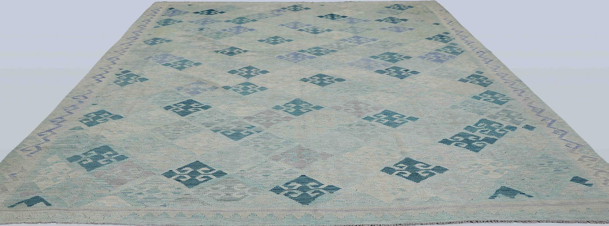 A Kilim carpet, c. 392 x 294 cm.