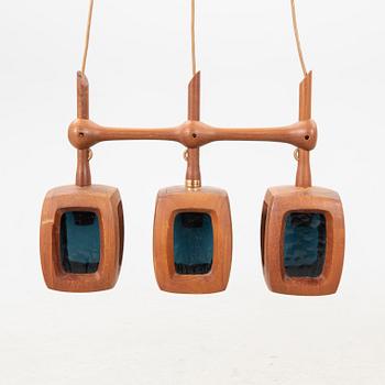 A 1960s teak ceiling pendant from Stilarmatur Tranås.