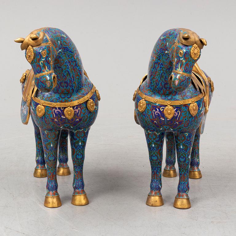 A pair of Chinese cloissoné horses, 20th Century.