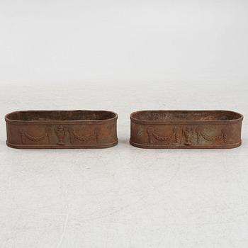 A pair of cast iron planters, 20th Century.