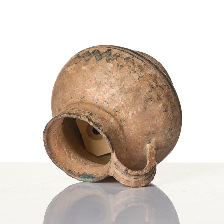 A central Asian pottery jug 12th-13th century.