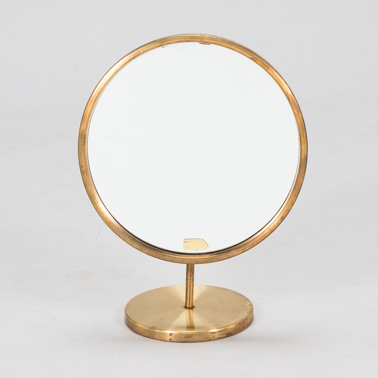 A brass table mirror, Glas Mäster, Markaryd, Sweden.