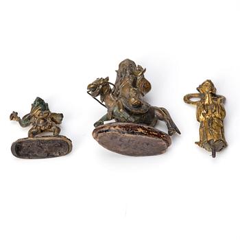 A group of three bronze miniatures sculptures of deities, China and Tibet, 18th Century.