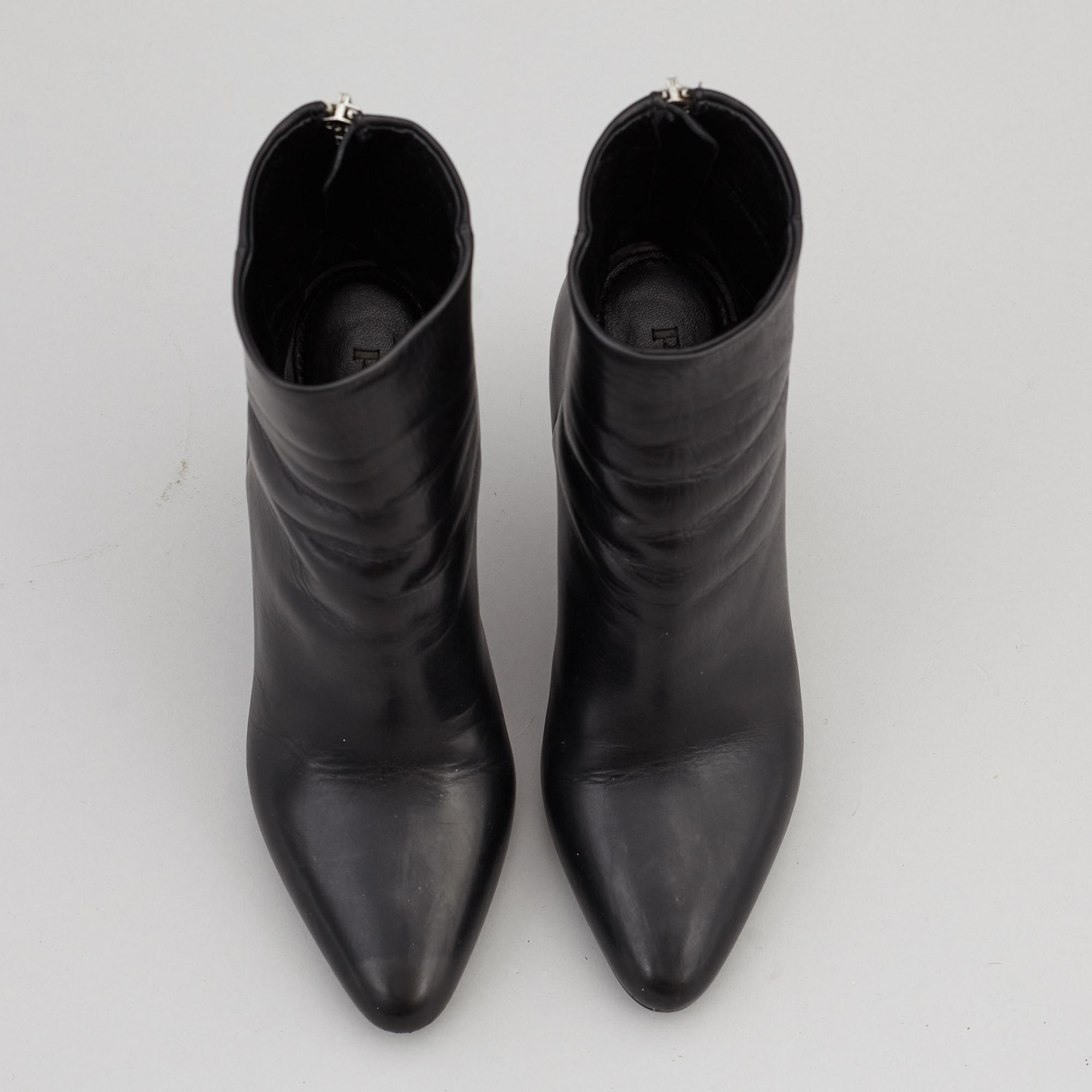 PRADA, a pair of black leather boots, size 35.