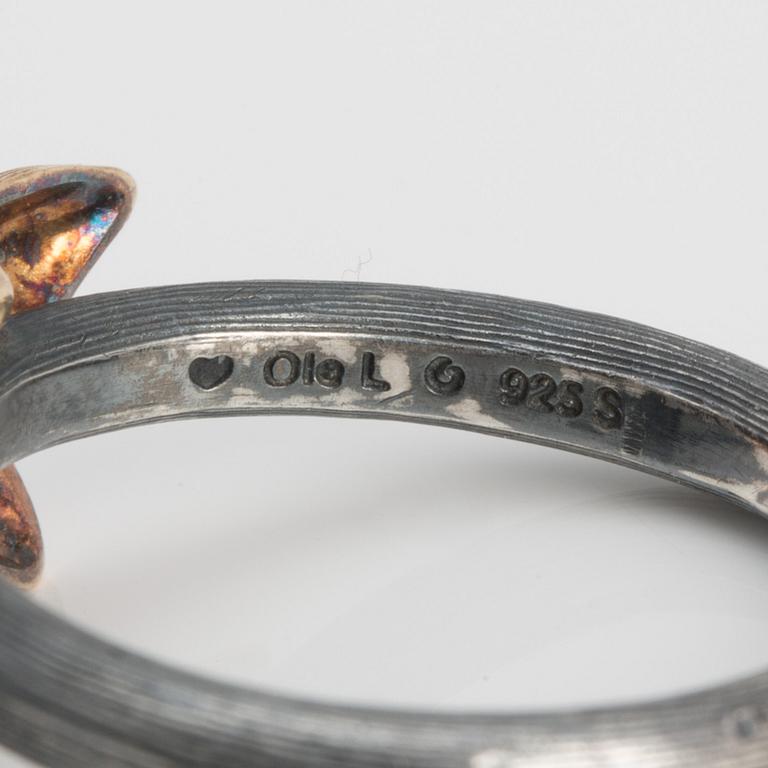 OLE LYNGGAARD COPENHAGEN, a sterling silve ring with 3 small dimonds,.