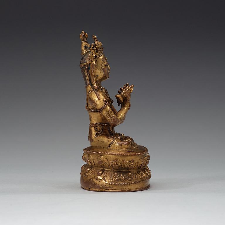 A gilt copper alloy figure of Vajradhara, possibly Tibet, 15/16th Century.