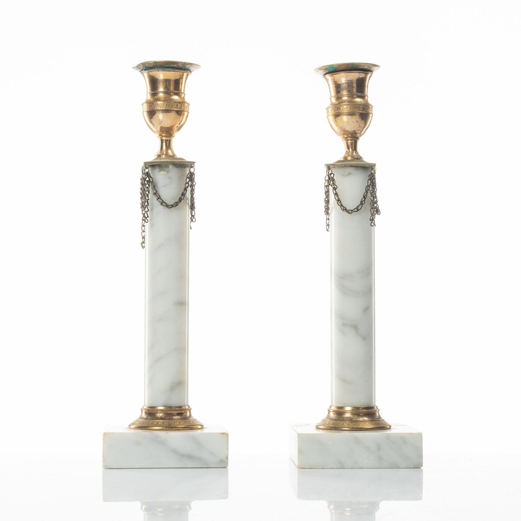 A pair of gilt-brass and marble late Gustavians candlesticks, late 18th century.