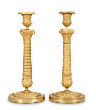 A pair of French Empire early 19th Century candlesticks.