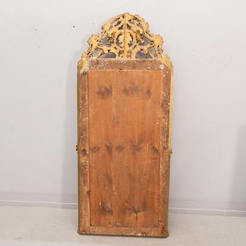 A bronzed Neo Rovovo mirror and table later part of the 19th century.