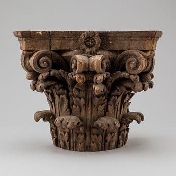An 18th century carved wood corinthian capital.