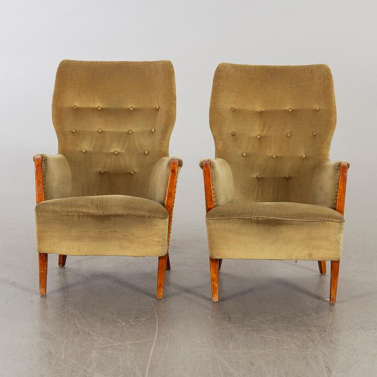 A pair of first half of the 20th century lounge chairs.