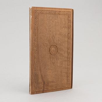 A keepsake book embellished by Ellen Jolin featuring a 'Santa Claus' figure.