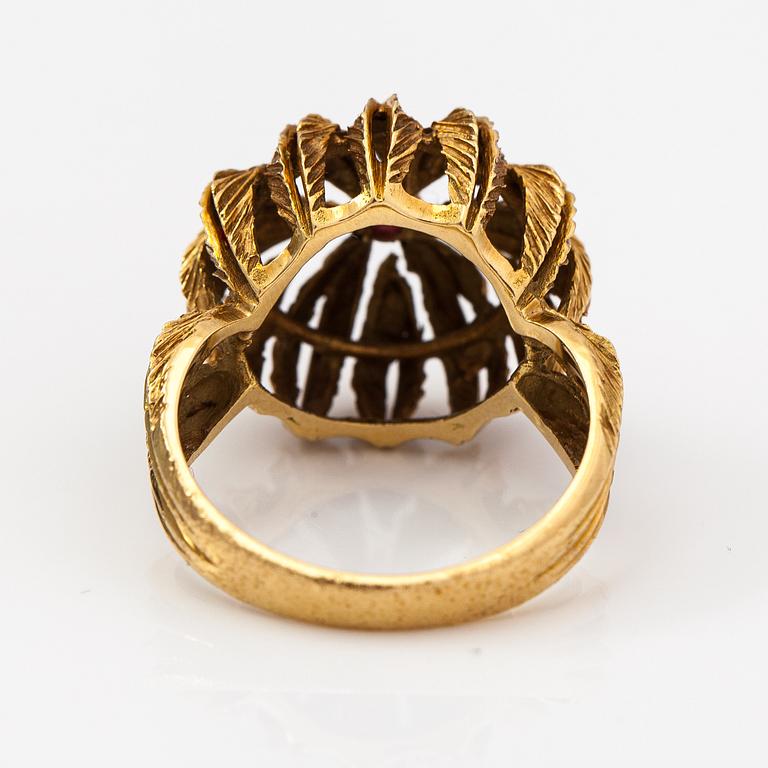 An 18K gold ring with a ruby.