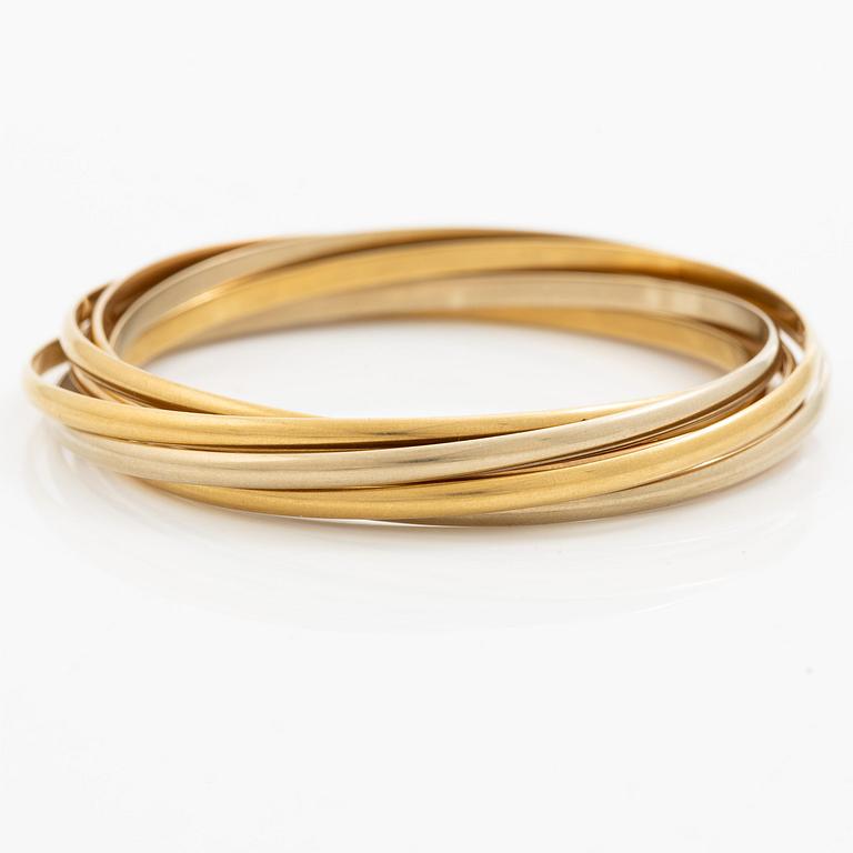 A Cartier bangle "Trinity" 18K gold in three colours.