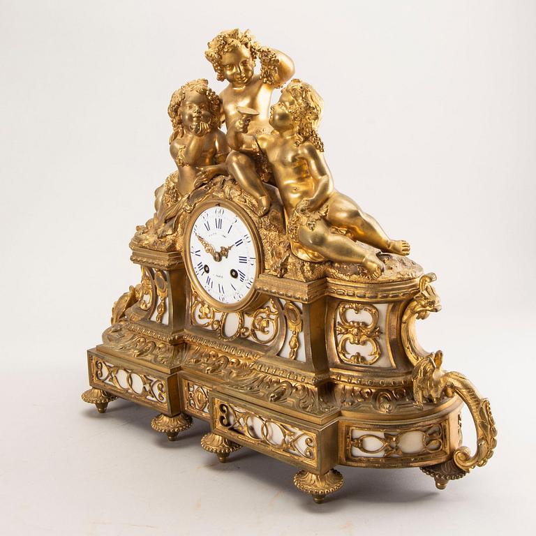 A Louis XV style table clock around 1900.