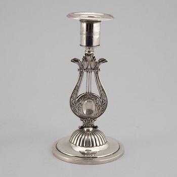 A Swedish 19th century matched set of four silver candlesticks, mark of Johan Petter Grönvall, Stockholm 1824.