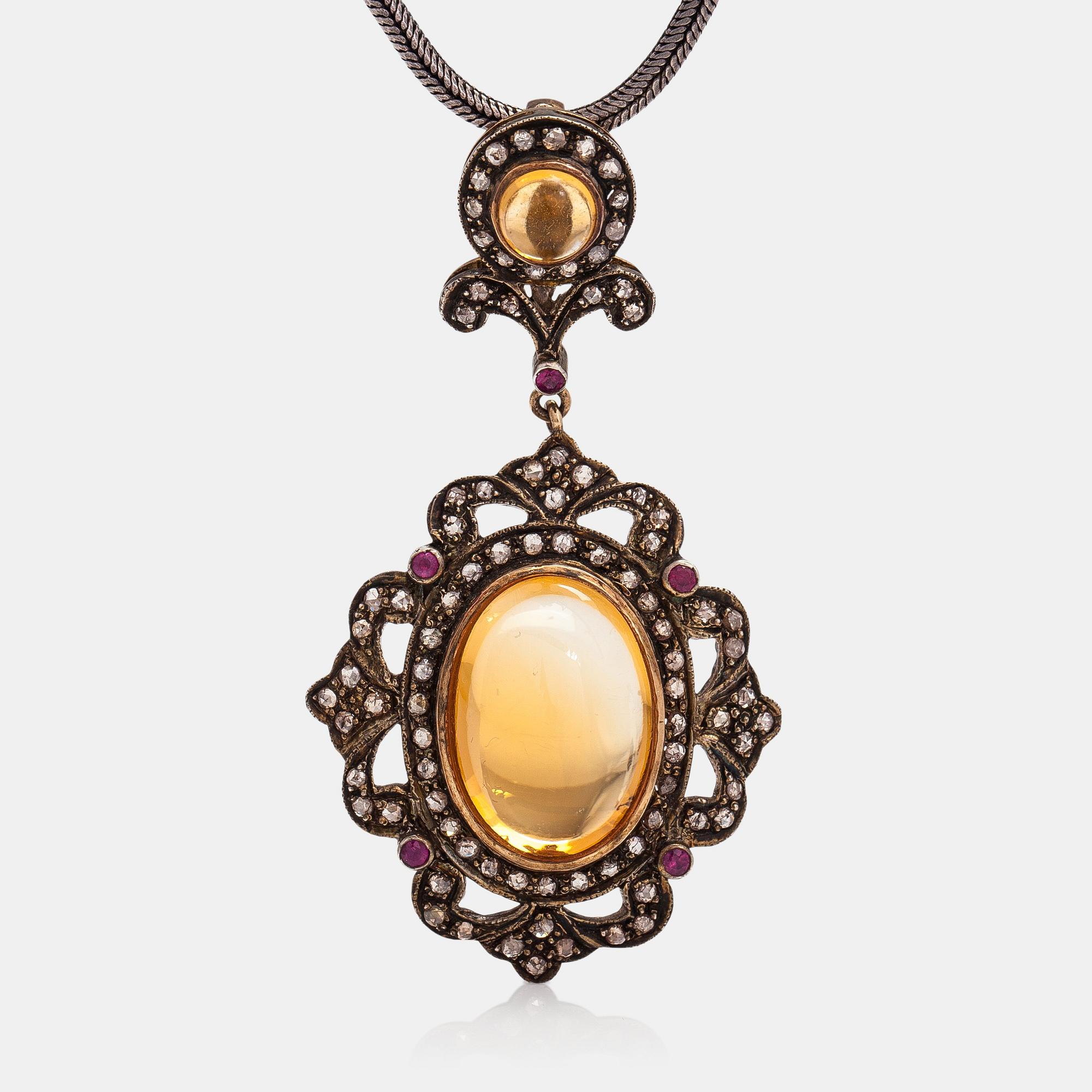 A 14K gold and silver necklace with citrines, rubies and rose-cut diamonds ca. 0.25 ct in total.