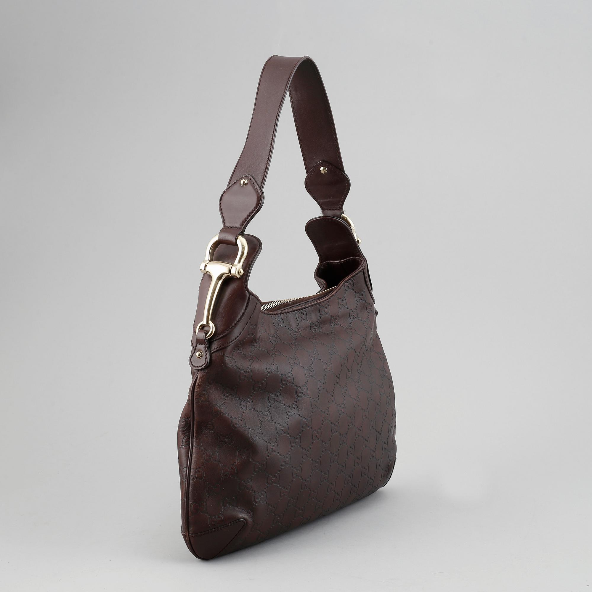 Gucci, a leather bag.