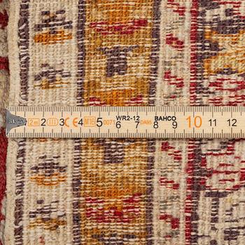 An oriental carpet, c. 195 x 70 cm.