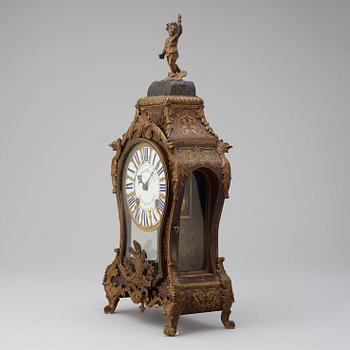 An 18th century mantel clock, probably Suisse.