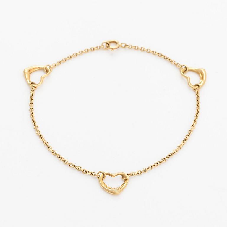 Tiffany & Co, an 18K gold 'Open Heart' bracelet.