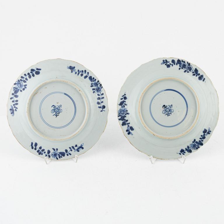 A set of four blue and white dinner plates, Qing dynasty, 18th Century.
