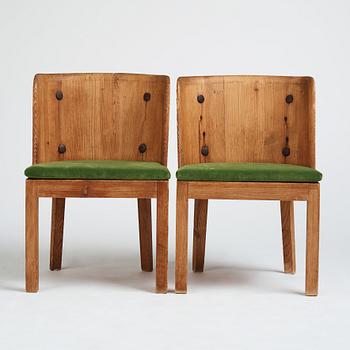 Axel Einar Hjorth, a pair of stained pine 'Lovö' chairs, Nordiska Kompaniet Sweden 1930s.