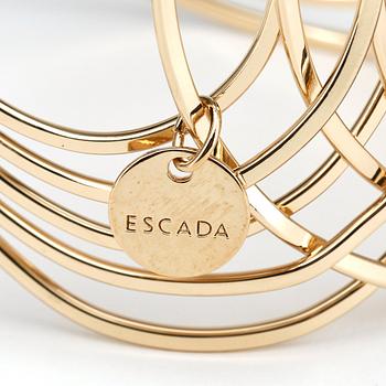 ESCADA, a golden bracelet.