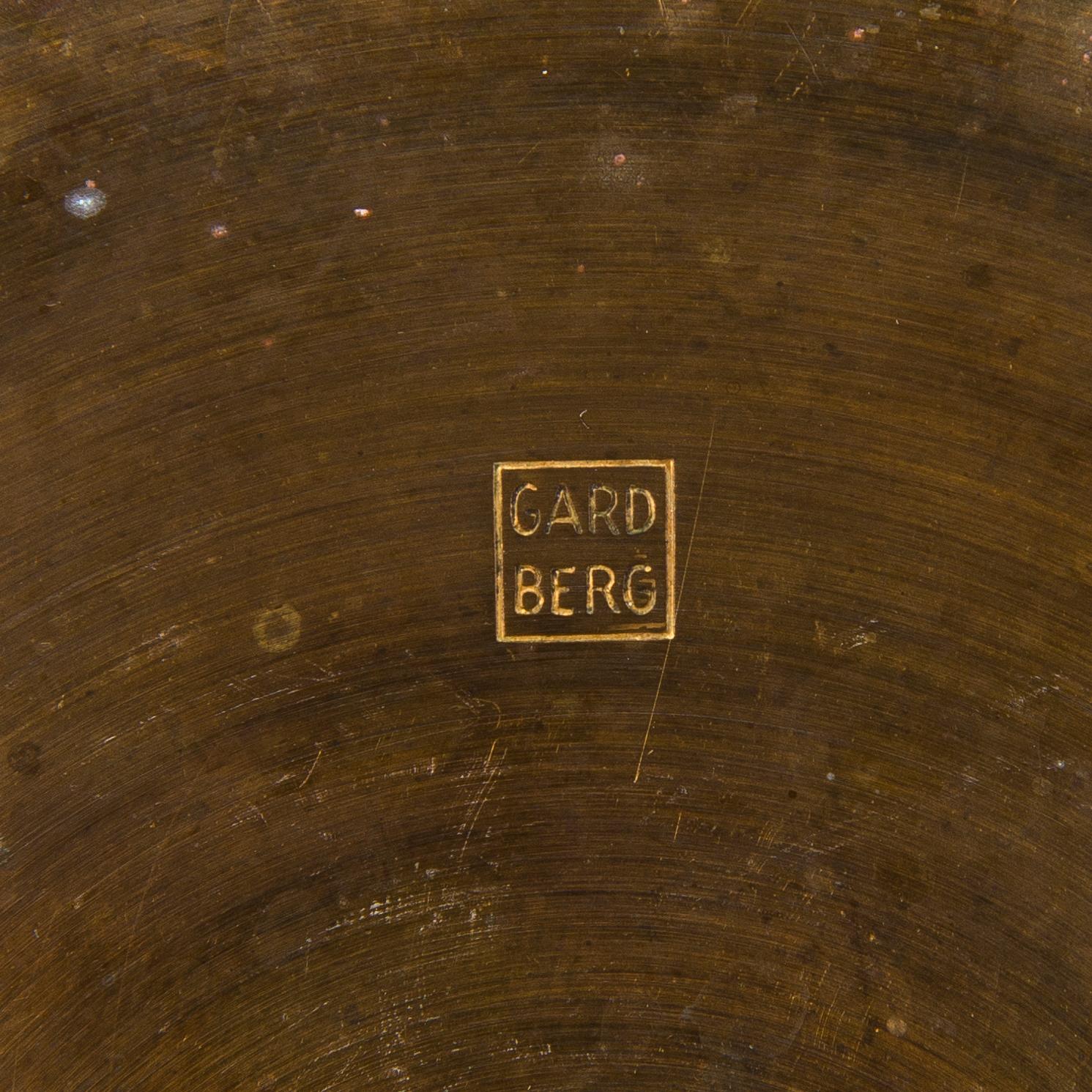 BERTEL GARDBERG, A pair of candleholders in brass, marked Gardberg.