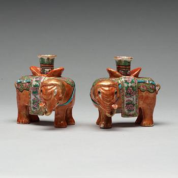 A pair of Canton candle sticks in the shape of elephants, Qing dynasty, 19th century.