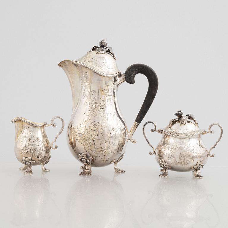 A Swedish Silver Coffee Pot, Creamer and Sugar Bowl, mark of W.A. Bolin, Stockholm 1956-62.