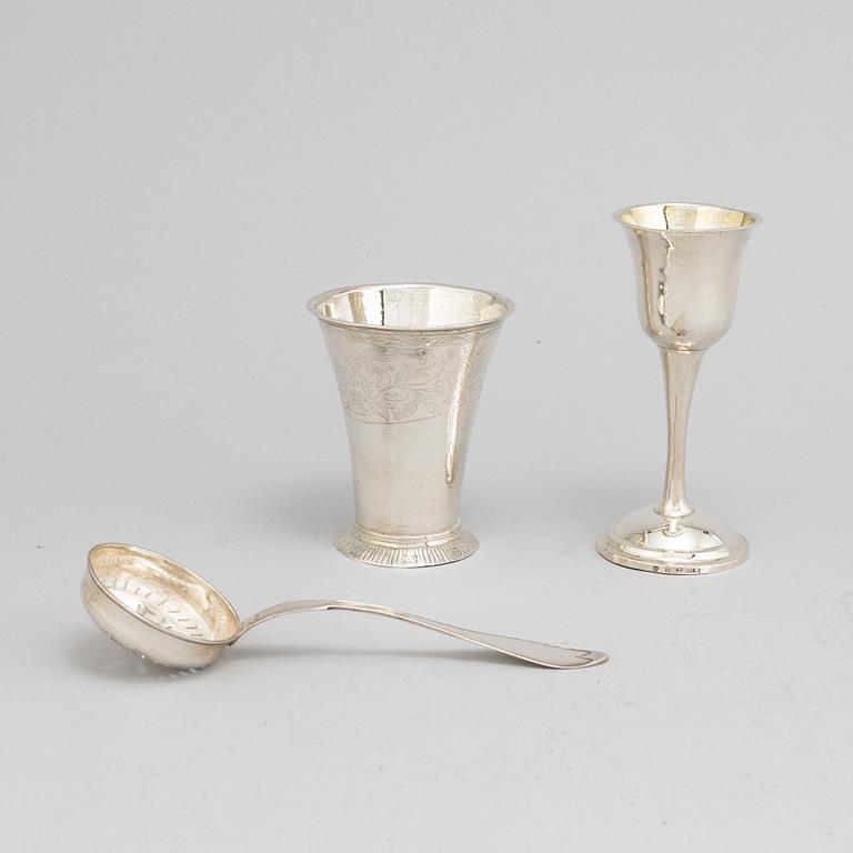 A Swedish 18th / 19th century silver beaker, cup and caster-spoon.
