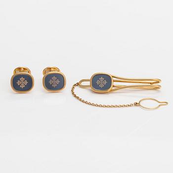 Patek Philippe, A set of 18K gold and sapphire crystal "Ellipse Calatrava" cufflinks and a tie pin .