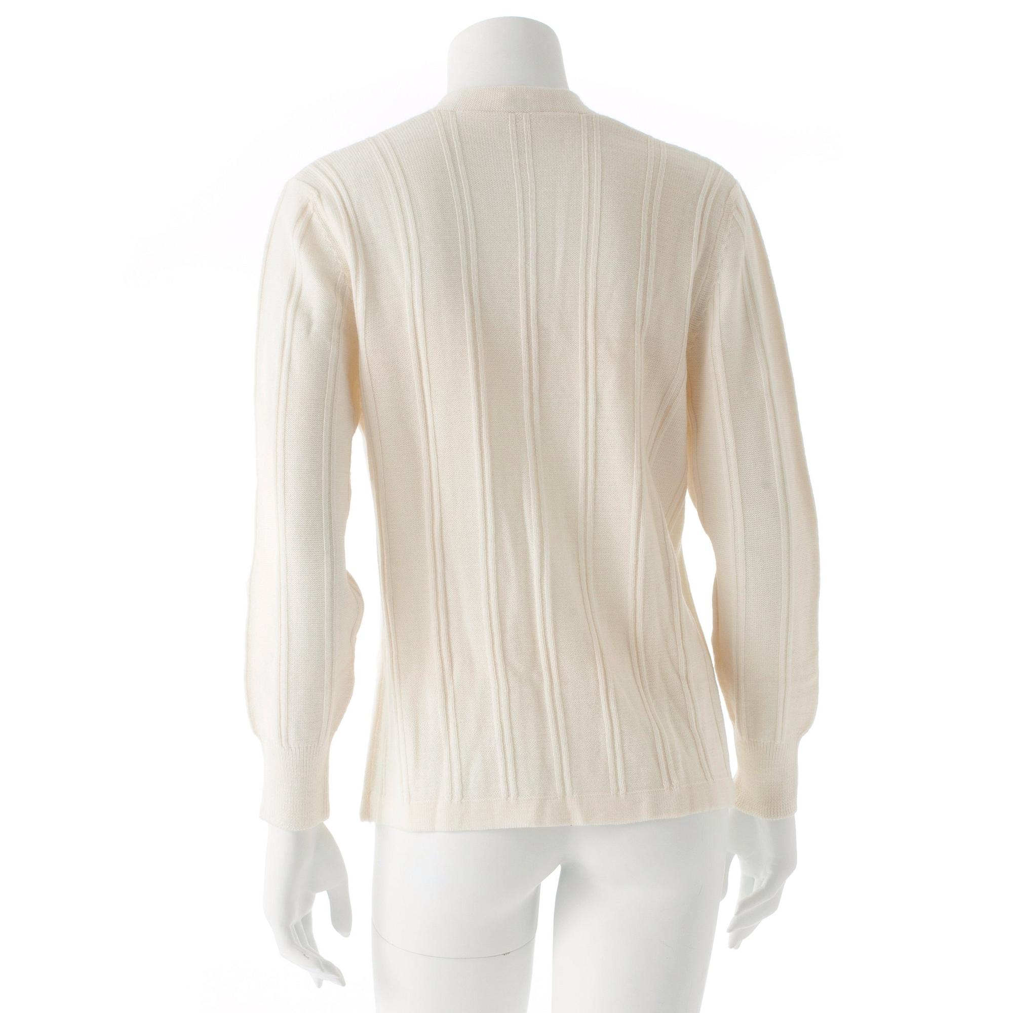 CÉLINE, a white wool cardigan.