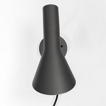 Arne Jacobsen, An 'AJ' wall lamp, Louis Poulsen. 21st century.