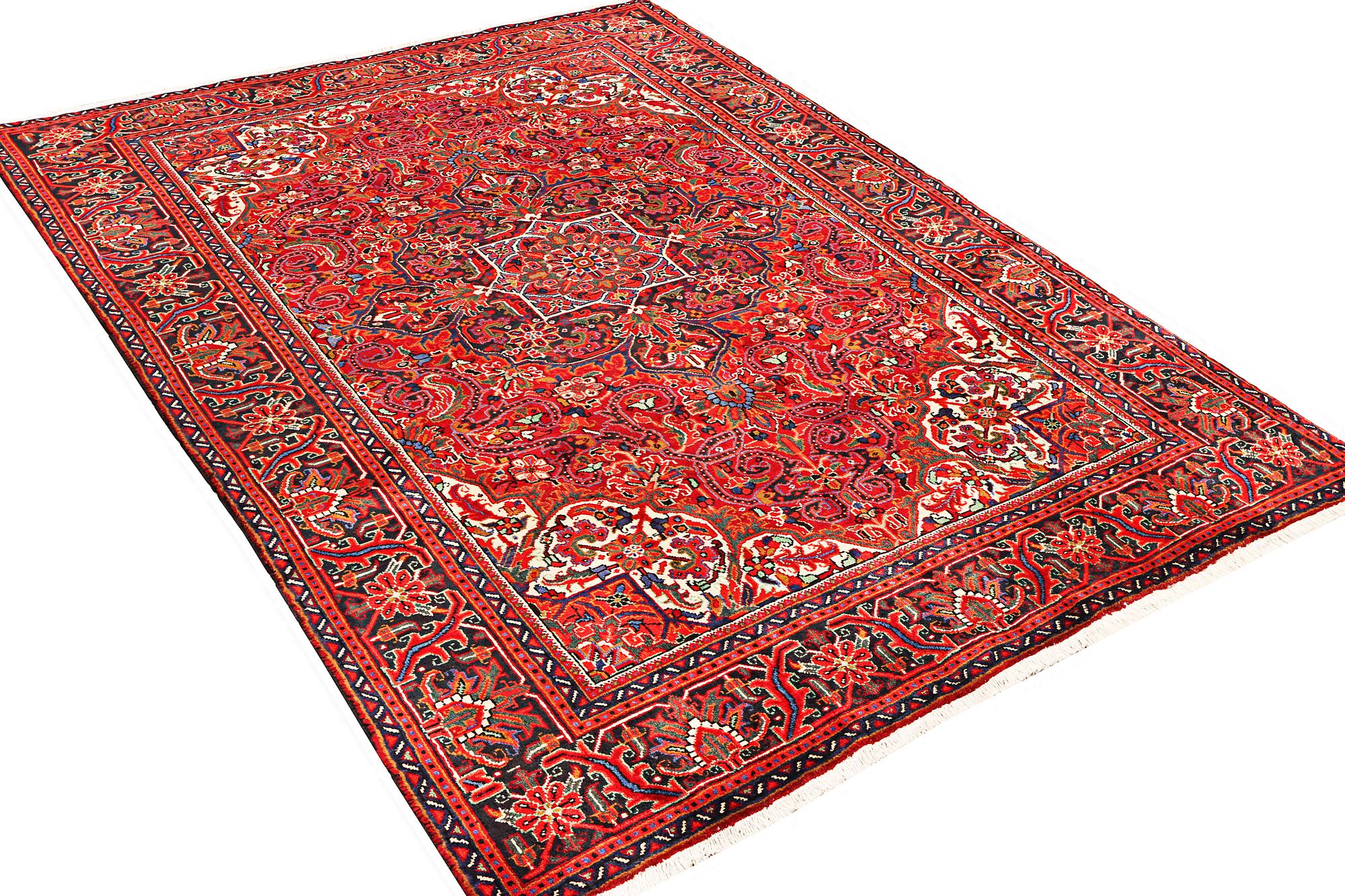 A Heriz patternd carpet, a.  295 x 207 cm.