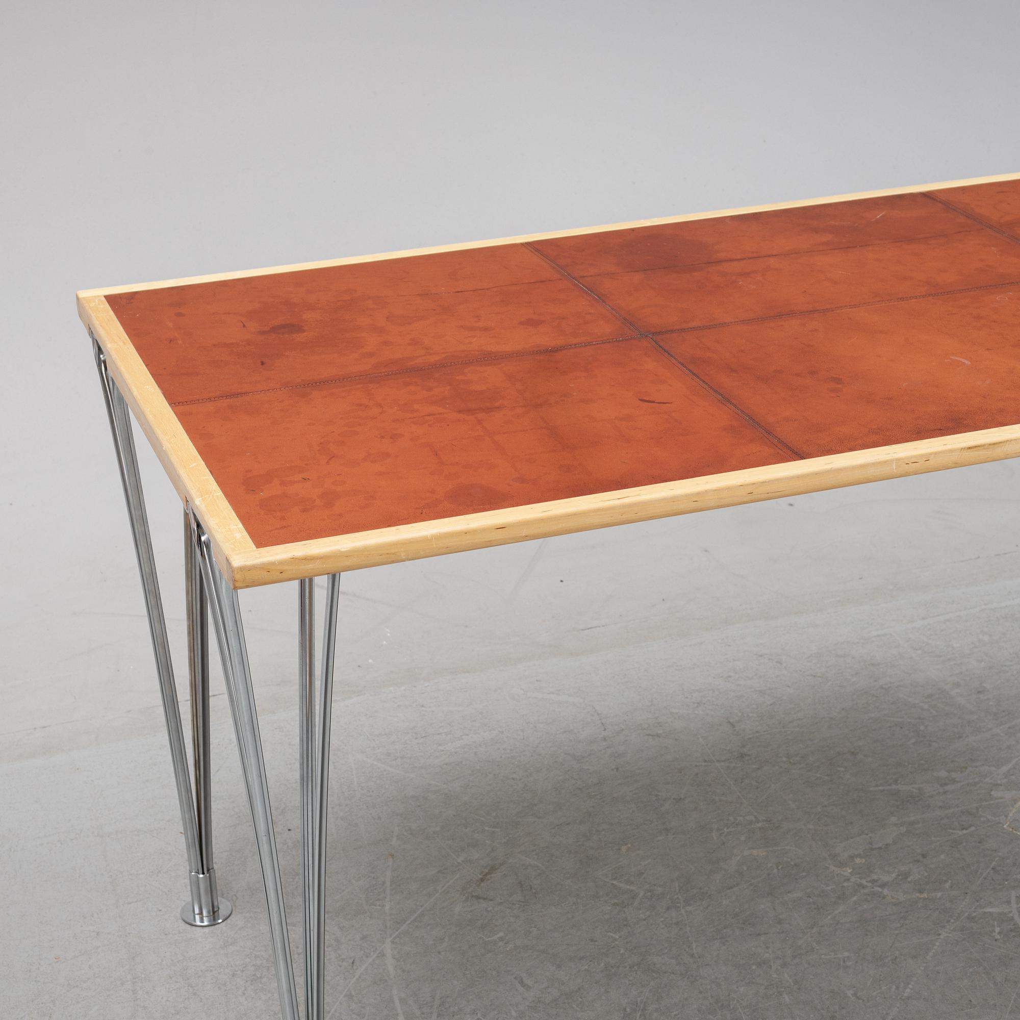 A birch and leather dining table produced by Mathsson International, 21th century.