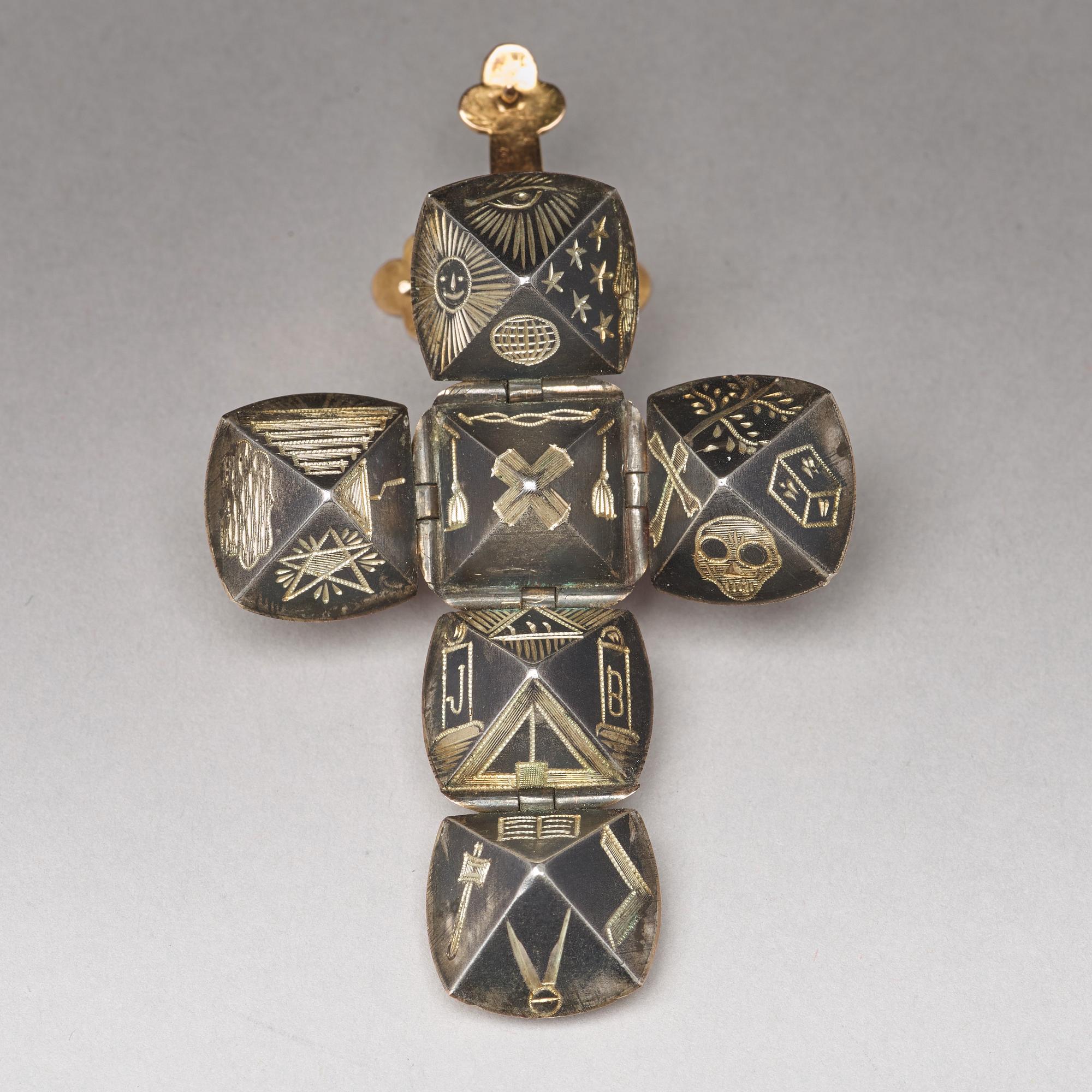 A gold and silver Masonic ball and cross pendent and a Freemason sign, unmarked c:a 1900.