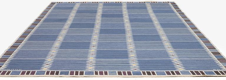 Barbro Nilsson, a carpet, 'Salerno blå med enkel bård', flat weave, c. 365 x 244 cm, signed AB MMF BN.