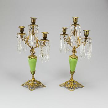 A pair of late 19th Century gilt candelabra.