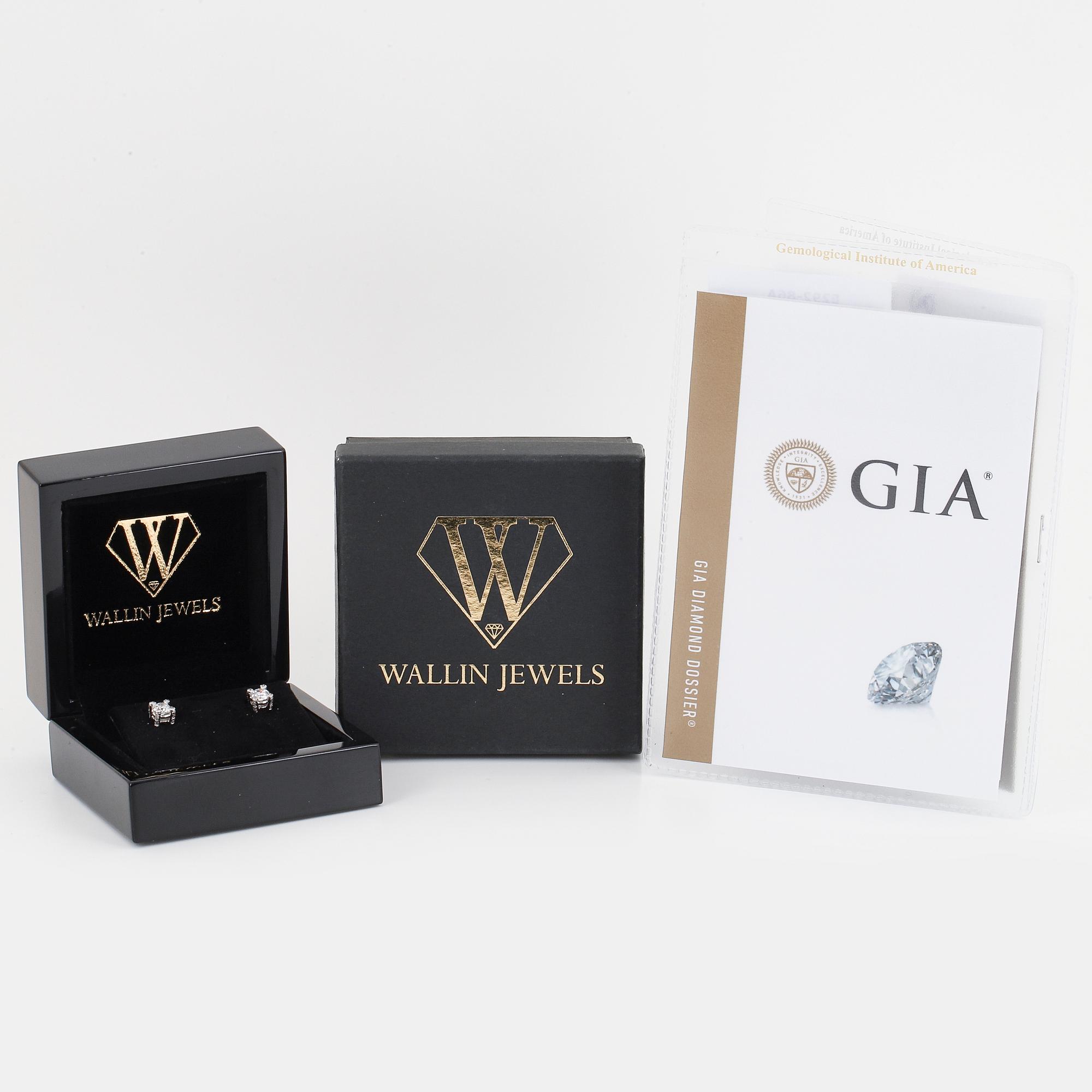 Brilliant-cut diamond stud earrings.