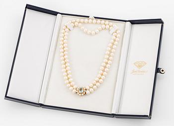 A two strand cultured freshwater pearls necklace, clasp 18K gold with an aquamarine.