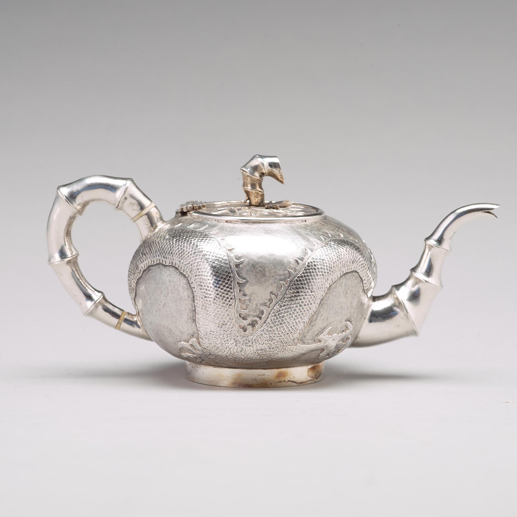 A Chinese four piece silver tea set, Luen Wo, Shanghai, 1875-1925.